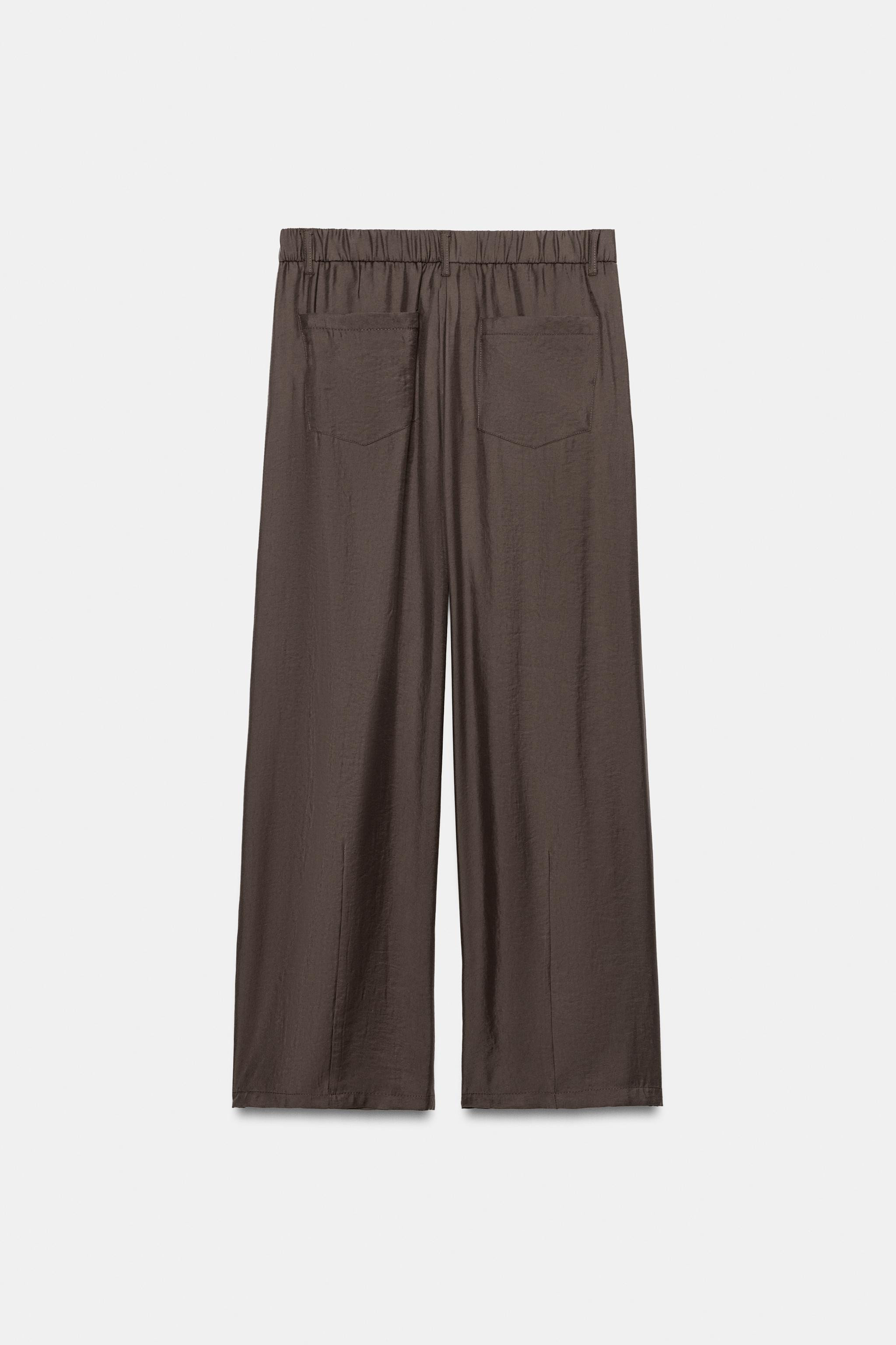 Trousers made from a flowing fabric. High-waist design with belt loops. Featuring side pockets, b... | Zara UK