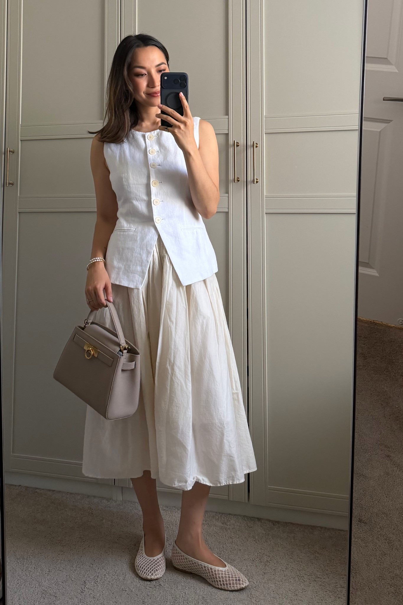 Spring summer outfit styling a midi skirt & mesh flats 

Jcrew vest 
Wayf skirt - old linked similar options 
Calvin Klein mesh flats - on sale! 
Parisa wang bag 