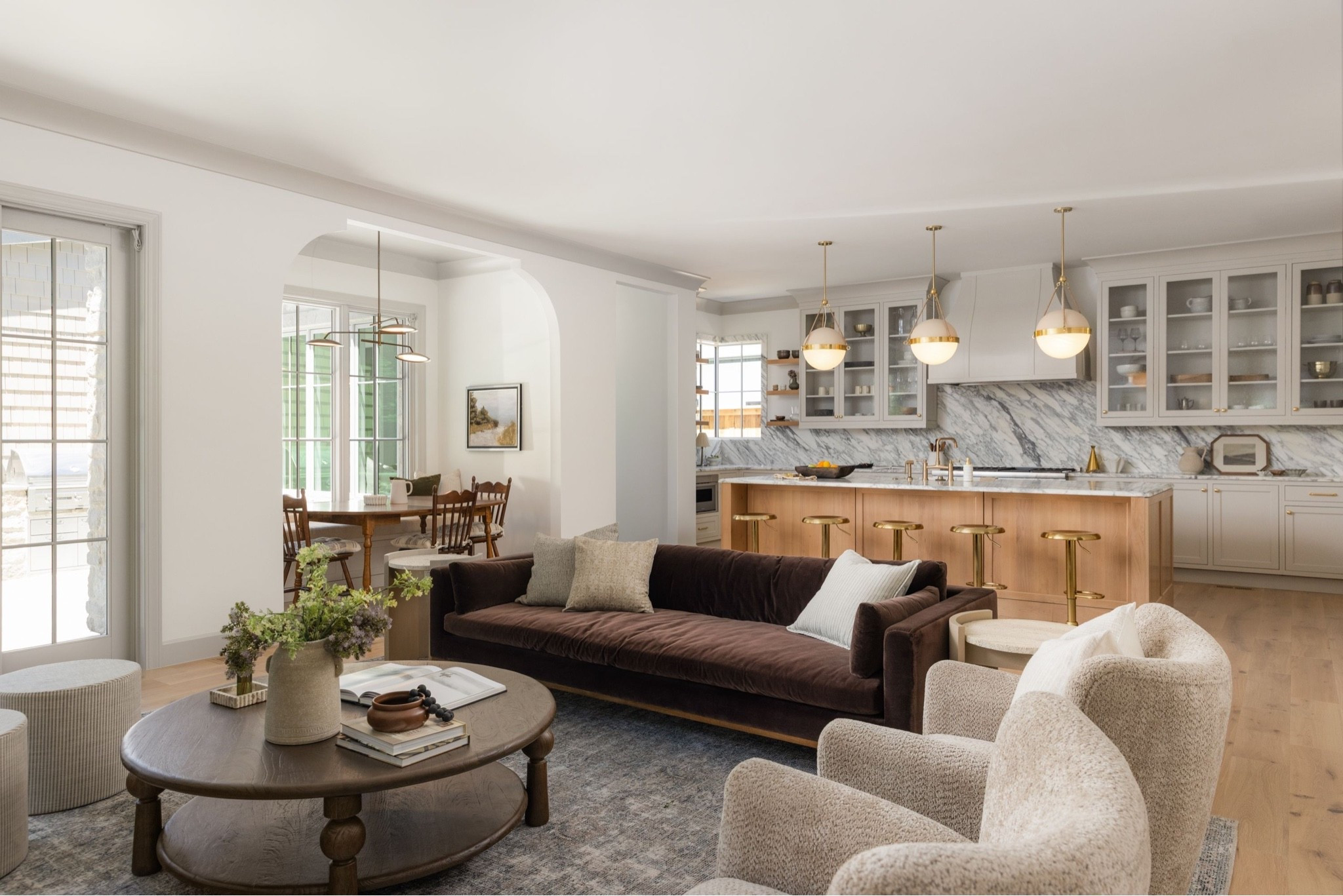 Antique-inspired rug, velvet brown sofa, boucle club chairs, dark wood coffee table + travertine side table—this living room is the perfect mix of timeless texture and cozy. 

Living room, rug, sofa, coffee table, accent chair, side chair, dining chair, dining, bar stool, stools, kitchen

#LTKHome