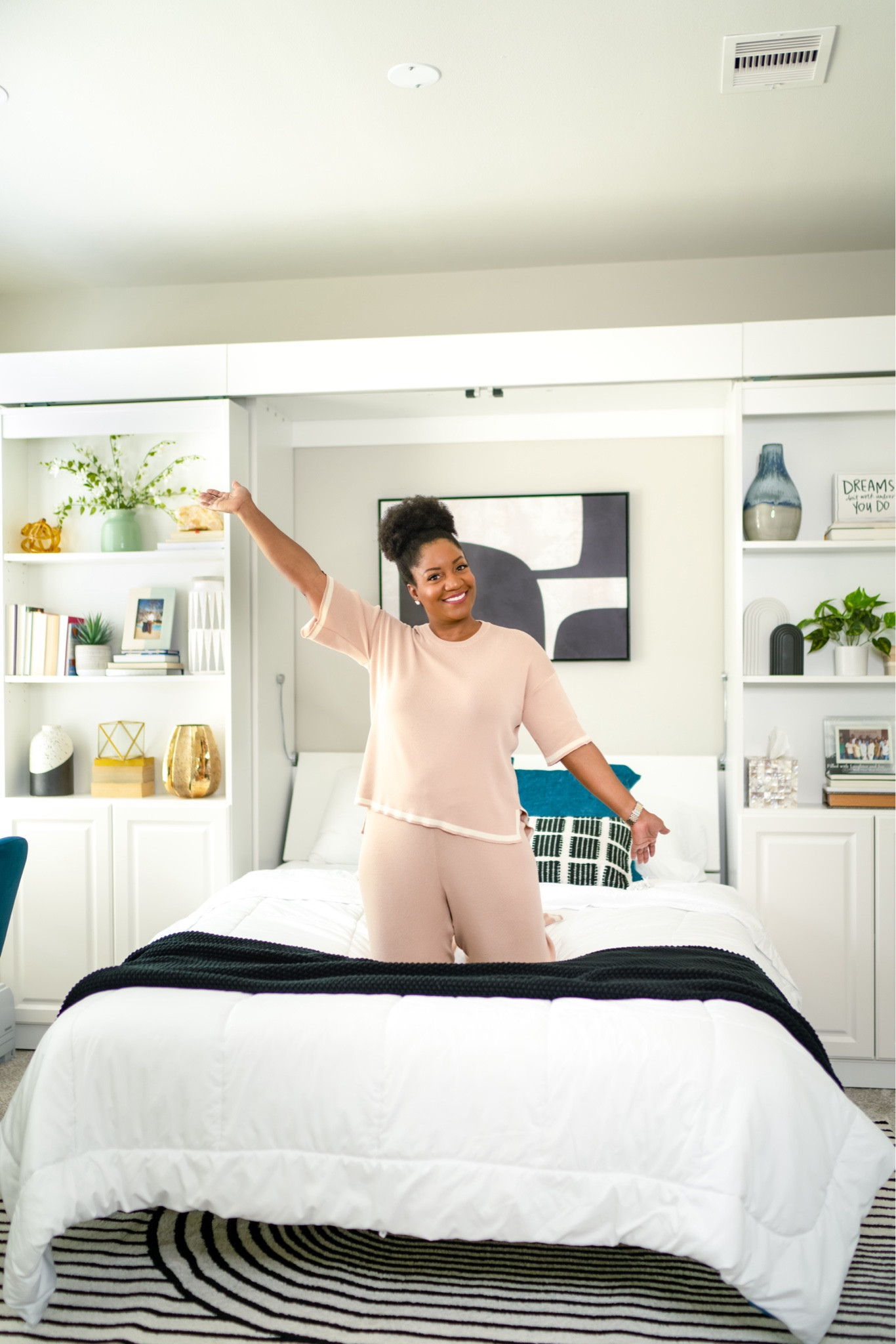 Showing off my Murphy bed in this cute lounge set from @amazon (wearing a L). I linked the bedding, rug, shelf decor, and similar Murphy beds.

#LTKSeasonal #LTKHome #LTKMidsize