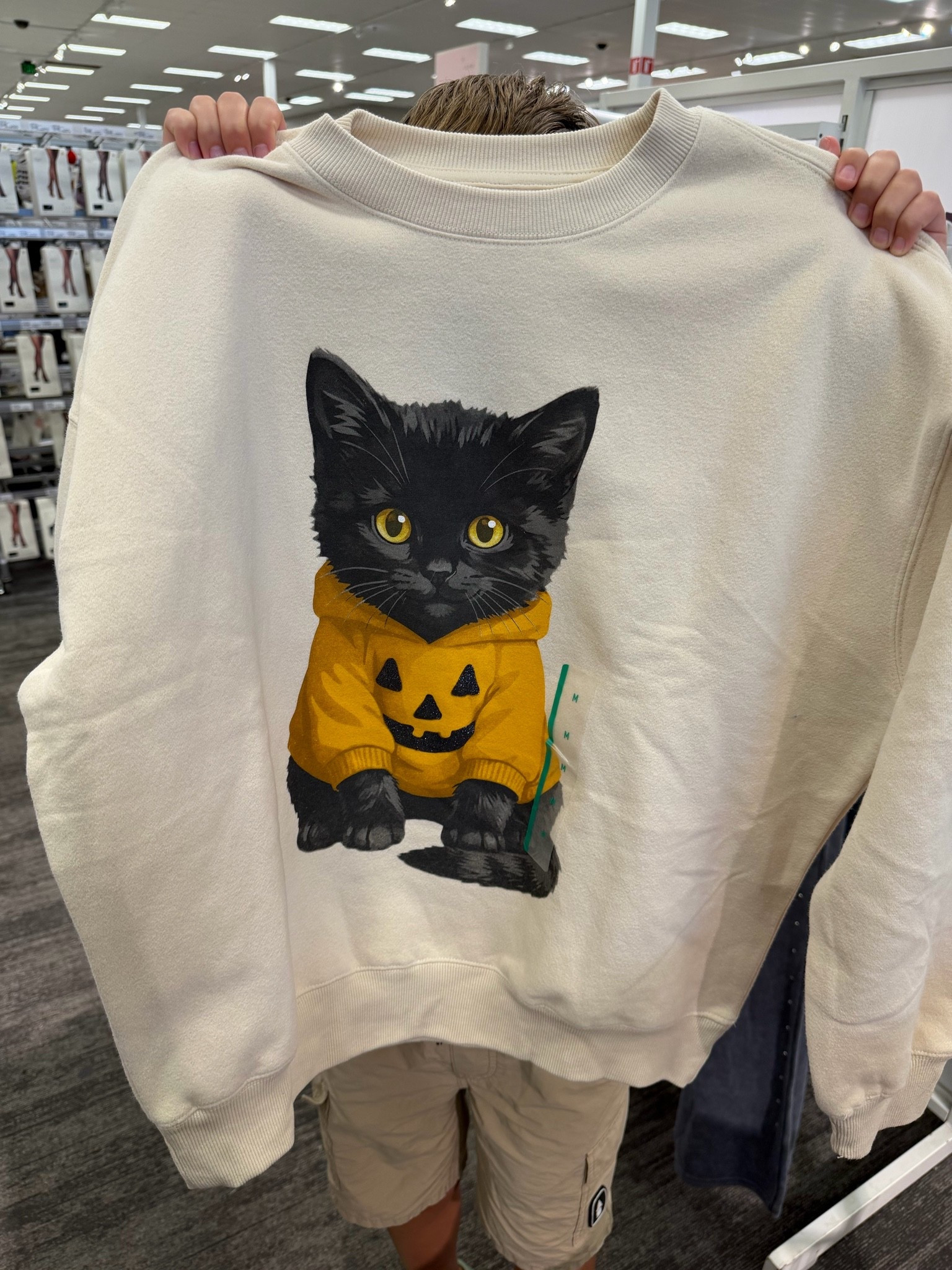 The cutest new graphic Halloween sweatshirt at Target! Special thanks to my oldest child for holding it up lol #targetstyle