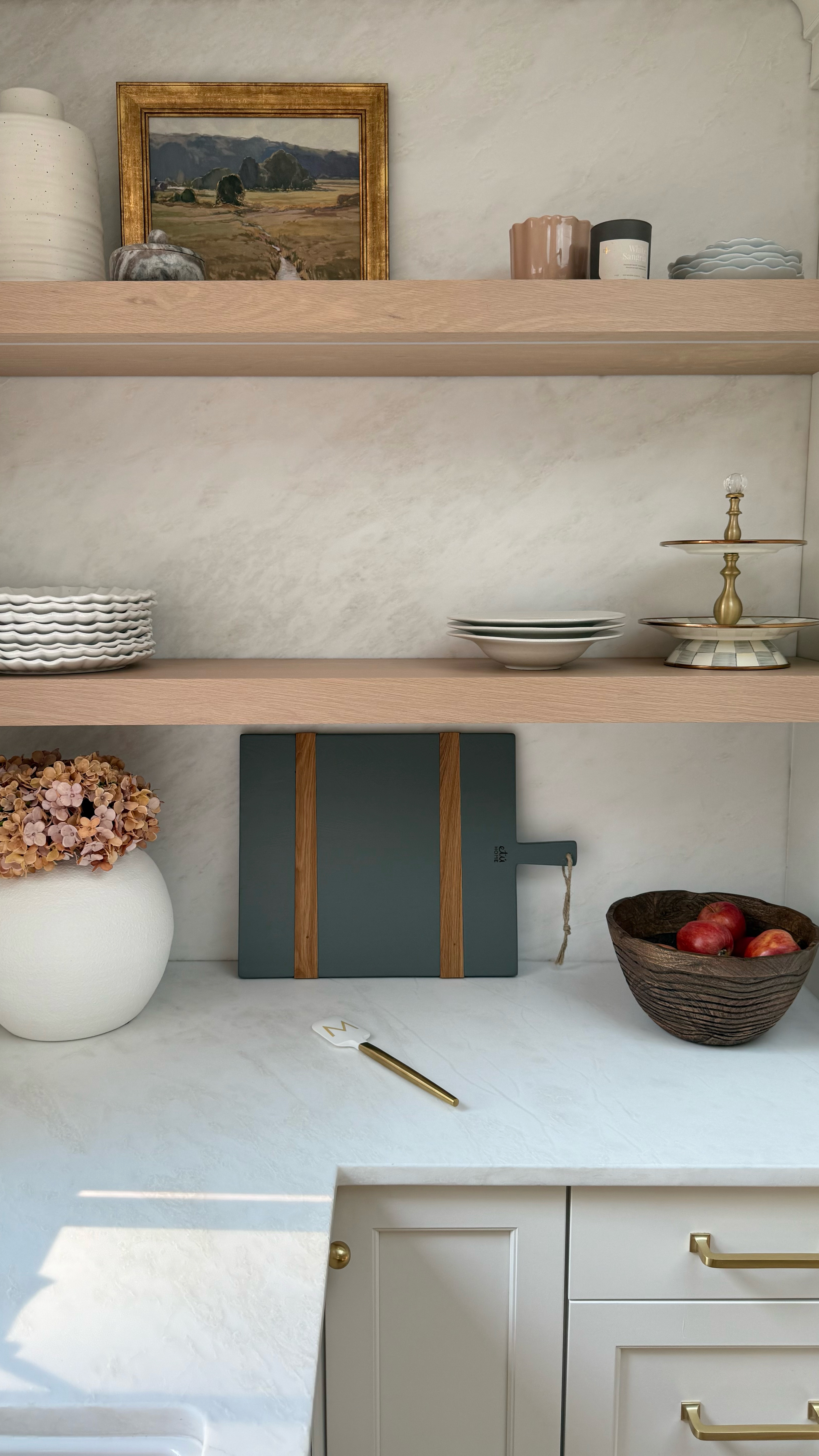 Kitchen decor details on our open shelving ✨ I’ve linked our cutting board, wood bowl, vintage art, marble jar, & brass spatula 🩷



#LTKSeasonal #LTKSaleAlert #LTKHome