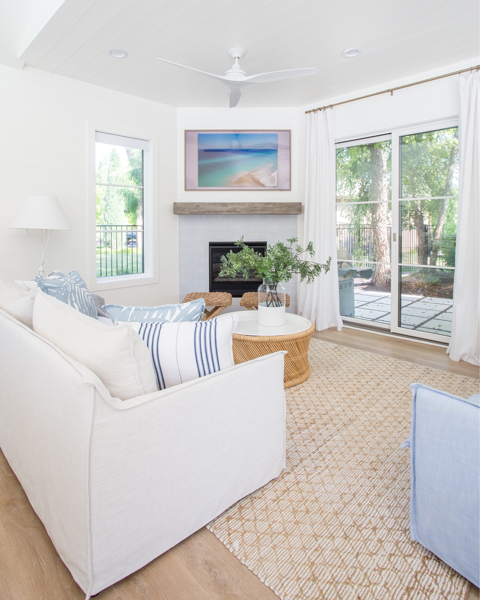 The pool house living room area in our prior house includes our indoor/outdoor sofa and swivel chairs, round coffee table, Frame TV, woven rug, coastal decor, subtle modern, ceiling fan, woven x-base stools, floating shelf mantle and blue and white pillows. 

family room ideas, pool house, serena and lily, area rug, blue and white decor, patio furniture, simple decor, home decor, amazon décor, living room decor, family room décor, targetfanatic, target style, amazon home, amazon finds, coffee table décor, serena and lily sofa, target finds, target home, family room #ltkfamily #ltkseasonal #ltkfind  

#LTKstyletip #LTKunder50 #LTKunder100 #LTKhome #LTKsalealert #LTKswim #LTKtravel #LTKSeasonal #LTKhome #LTKsalealert