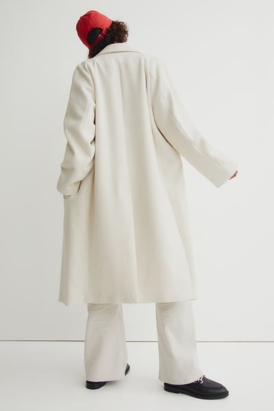 Relaxed-fit, calf-length coat in soft woven fabric. Notched lapels and concealed, double-breasted... | H&M (US)