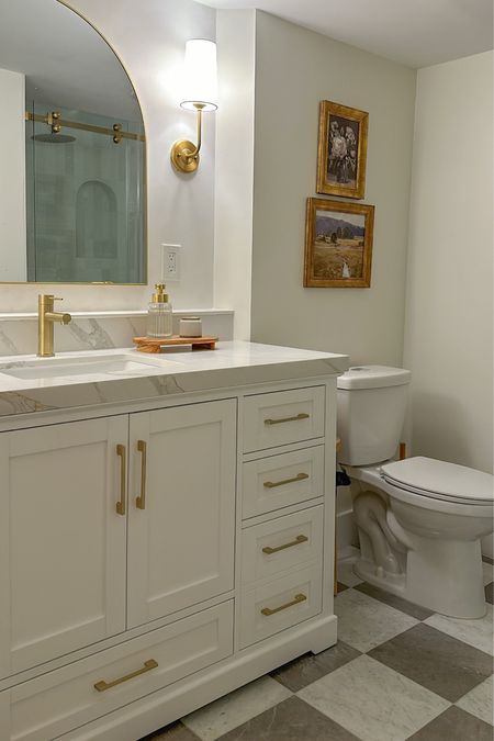 Master Bathroom Remodel!! Basically everything in this picture is linked! 

White bathroom - gold bathroom - checkered tile floor - wall sconces - arch mirror - wall art - arch shower niche 

#LTKstyletip #LTKU #LTKhome