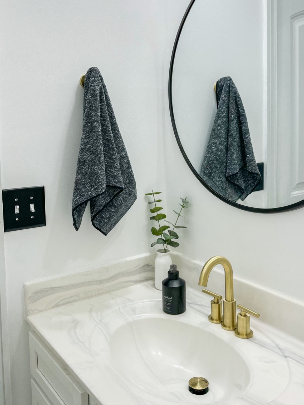 Black white bathroom with good faucet 

#LTKSaleAlert #LTKHome