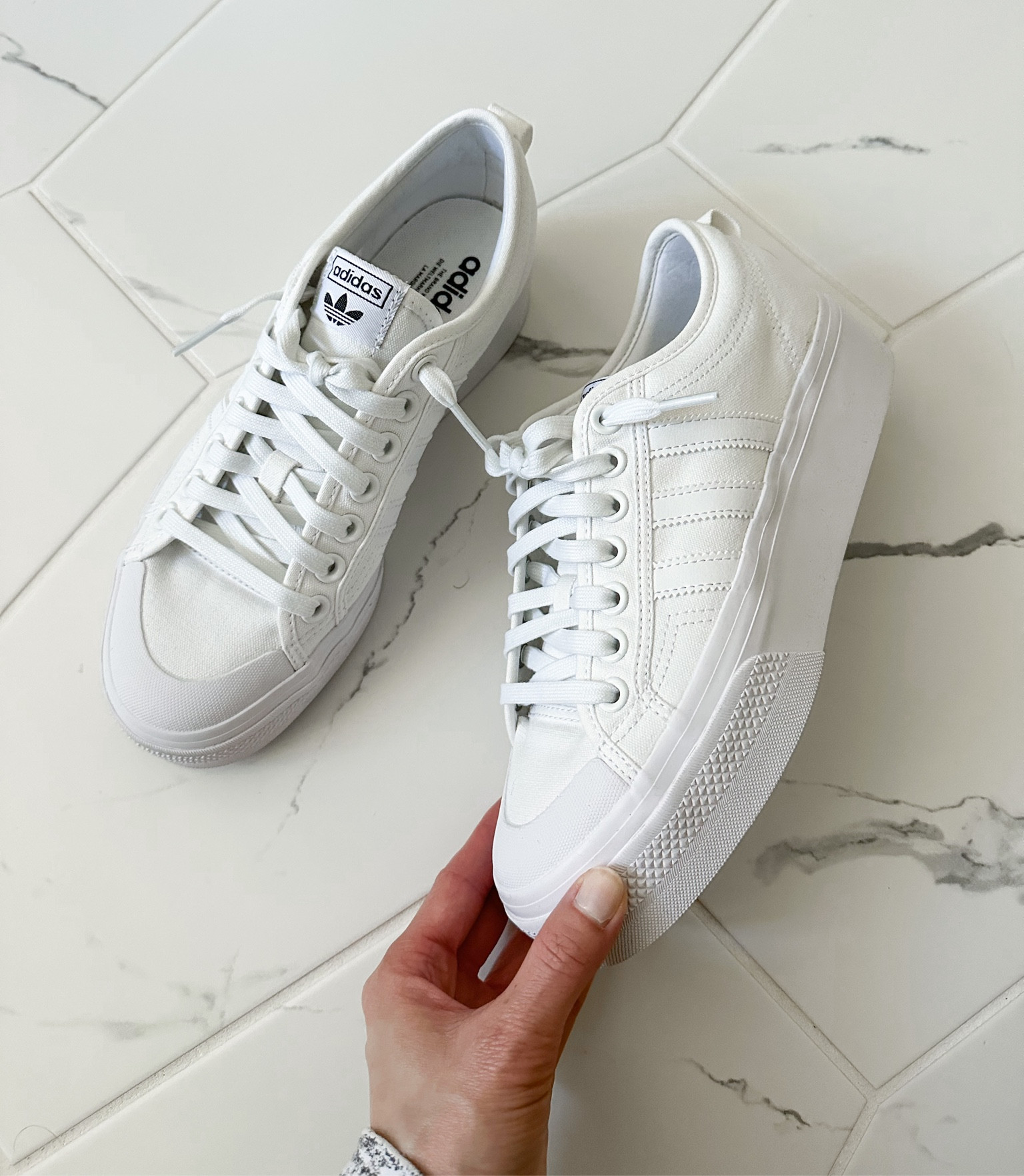 Platform sneaker. Will probably style these with a skirt & tshirt for the eras tour concert 🎶 Can’t believe how comfortable these are!! I got a size 9, which fits perfectly with a thicker sock, but they run a bit big. So I would stay TTS. 

#LTKshoecrush #LTKtravel #LTKxadidas