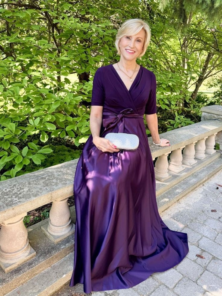 Elegance meets ease ✨ This Alex Evenings gown, with its surplice neckline, jersey bodice, and flowing satin skirt, is the perfect choice for a Fall wedding. Rich, regal, and timelessly chic. 🍂💜 #AlexEvenings #WeddingGuestStyle #FallElegance 

#LTKStyleTip #LTKOver40 #LTKSeasonal