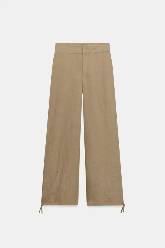 High-waisted linen pants. Wide leg finished with adjustable drawstrings. Front zip, interior butt... | Zara US