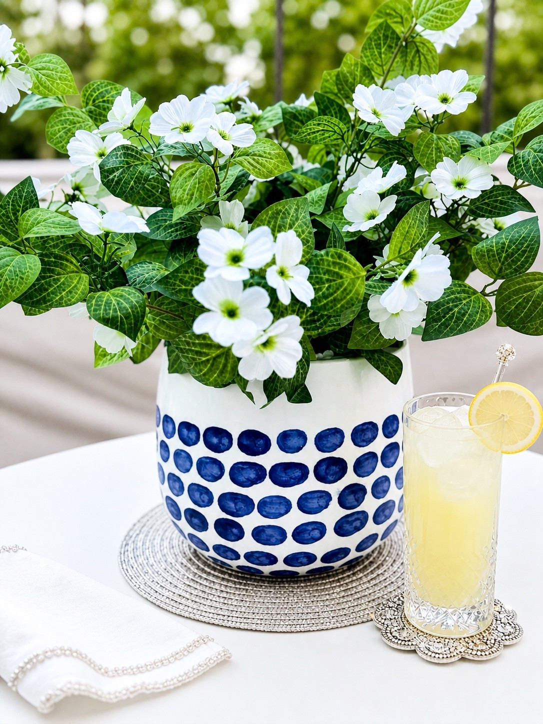 Simple summer table tip 💙🤍

Start with ONE statement piece—like this blue & white planter—and build your whole table around it. I added faux petunias for an easy, always-fresh look (no watering, no wilting 🙌), and that’s really all you need to create a pretty, pulled-together vibe.

Everything else? Just styling extras to elevate the look and give you more options to shop—think layered textures, a little sparkle, and a fresh drink moment 🍋✨

The key is keeping it simple and letting one focal piece do the work.

Shop everything in my LTK 🤍#liketkit @shop.ltk

#summerdecor #tablescapeinspo #blueandwhitedecor #ltkhome #ltkstyle #outdoorentertaining #summerentertaining #tabledecor #homedecorinspo #coastaldecor #simpledecor #hostesswiththemostess #prettylittleinteriors #decorinspo #eleganthome #styledtable

#LTKSeasonal #LTKHome