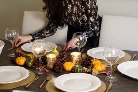 An easy and affordable way to elevate your dining table for Thanksgiving is to use slipcovers for your chairs. This instantly changes the look of your dining table without having to buy new furniture. #thanksgiving #holidays #entertaining #table #tablesetting #tablescape #partyplanning

#LTKhome #LTKfindsunder50 #LTKHoliday