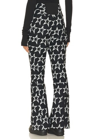 Perfect Moment Aurora Flare Pant in Black & Snow White Star Print from Revolve.com | Revolve Clothing (Global)