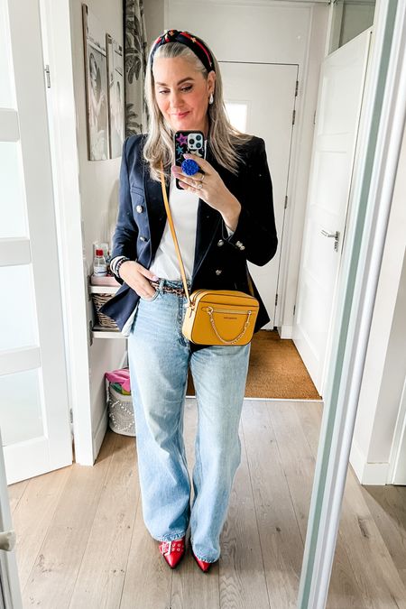 Ootd - Friday. A preppy headband (old), navy blazer (Zara, xl), the best basic white t-shirt from Uniqlo, wide legged jeans (old), Ganni lookalike red buckle shoes and a yellow Michael Kors crossbody bag (secondhand).



#LTKeurope #LTKover40 #LTKstyletip