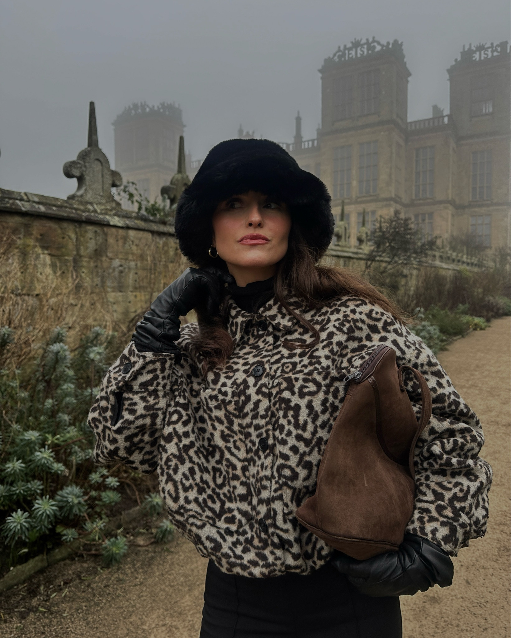 Leopard print bomber jacket, fur hat, furry bucket hat, leather gloves, brown suede handbag, black trousers, winter outfit, winter fashionn

#LTKuk #LTKeurope #LTKstyletip
