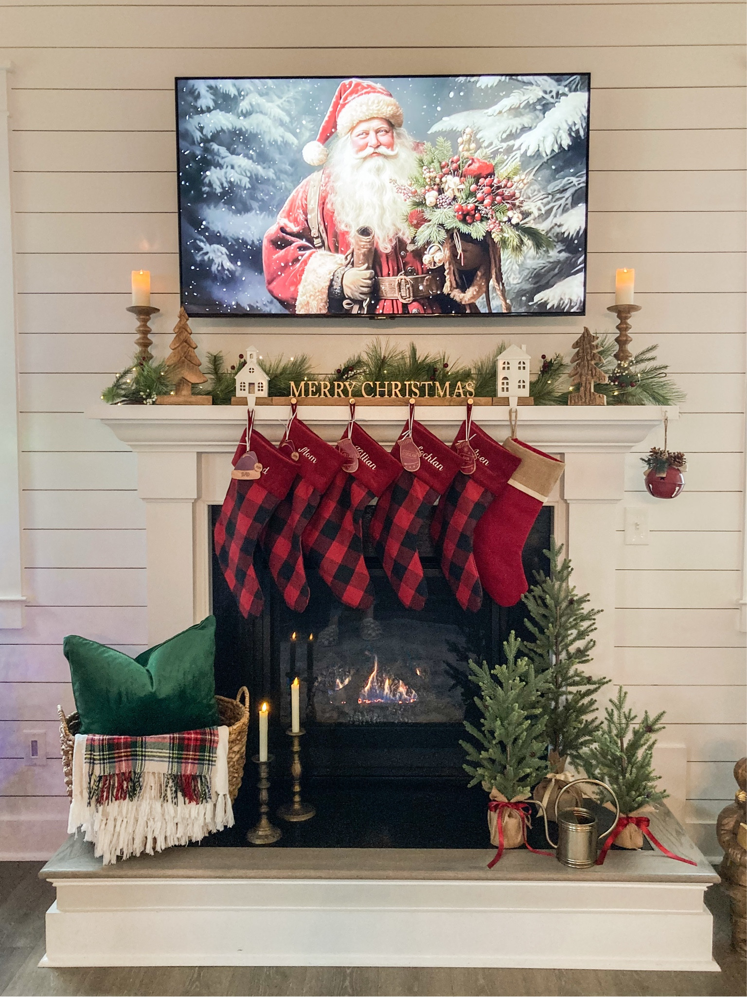 Love the way this Merry Christmas stocking holder looks paired with the green garland. So warm and cozy! I added two white houses to either end which makes it perfect for our family of 5+ dog. 

#LTKSeasonal #LTKHome #LTKHoliday
