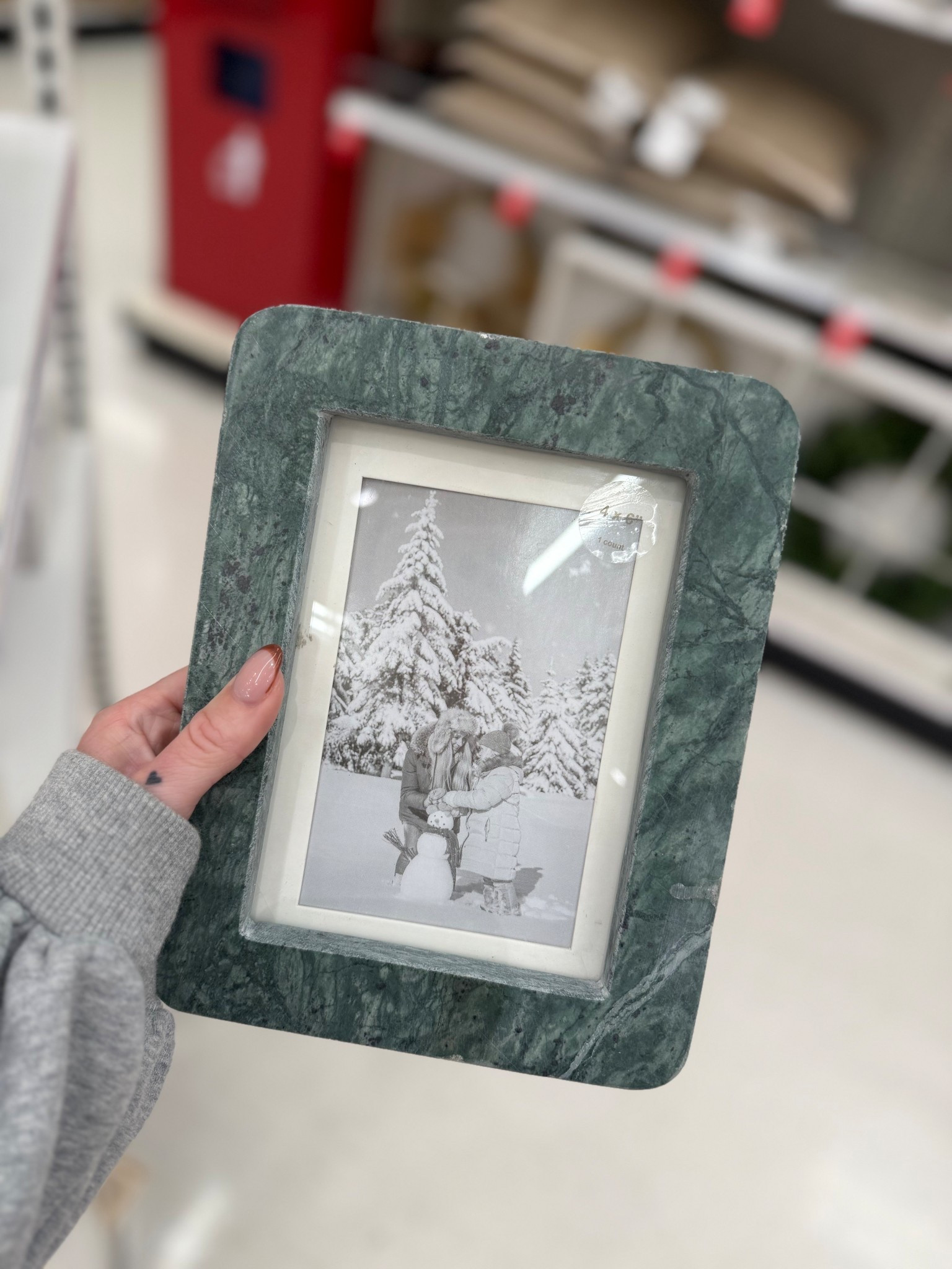 5"x7" Marble Picture Frame - Threshold™ designed with Studio McGee

 Crafted from genuine green marble, this rectangular frame adds a luxurious touch to any tabletop or shelf. Designed for vertical display, it features a sturdy easel back for easy placement and stability.