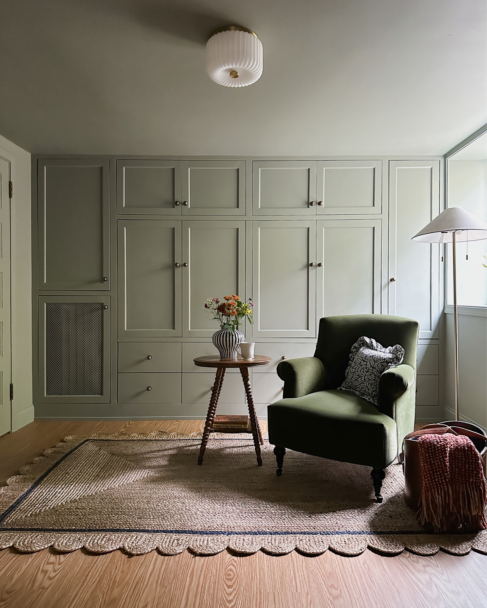 Guest bedroom / office with our diy murphy bed. Style meets function 👌. Swipe to see! Linking the bed kit and matress + items in this room. Head to patticakewagner.com and search “pigeon” for more info | ceiling flush mount lighting, knob hardware, upholstered accent chair, stripe vase, floor lamp, fall blanket, throw, ruffled pillow, leather basket, scalloped rug, spindle leg table (mine is second hand) | #falldecor

#LTKHome #LTKStyleTip