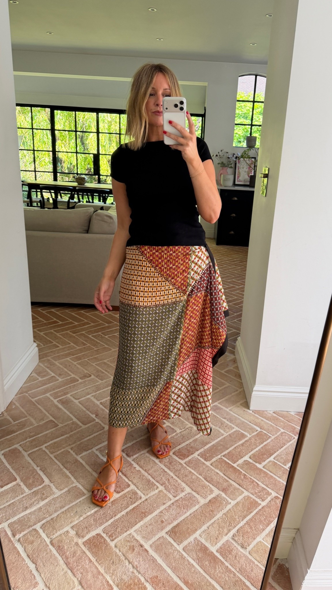 How I’m styling my new Jimmy Choo Sandals | Orange Sandals | printed skirt | Flore Flore | baby tee

#LTKeurope #LTKuk #LTKshoes