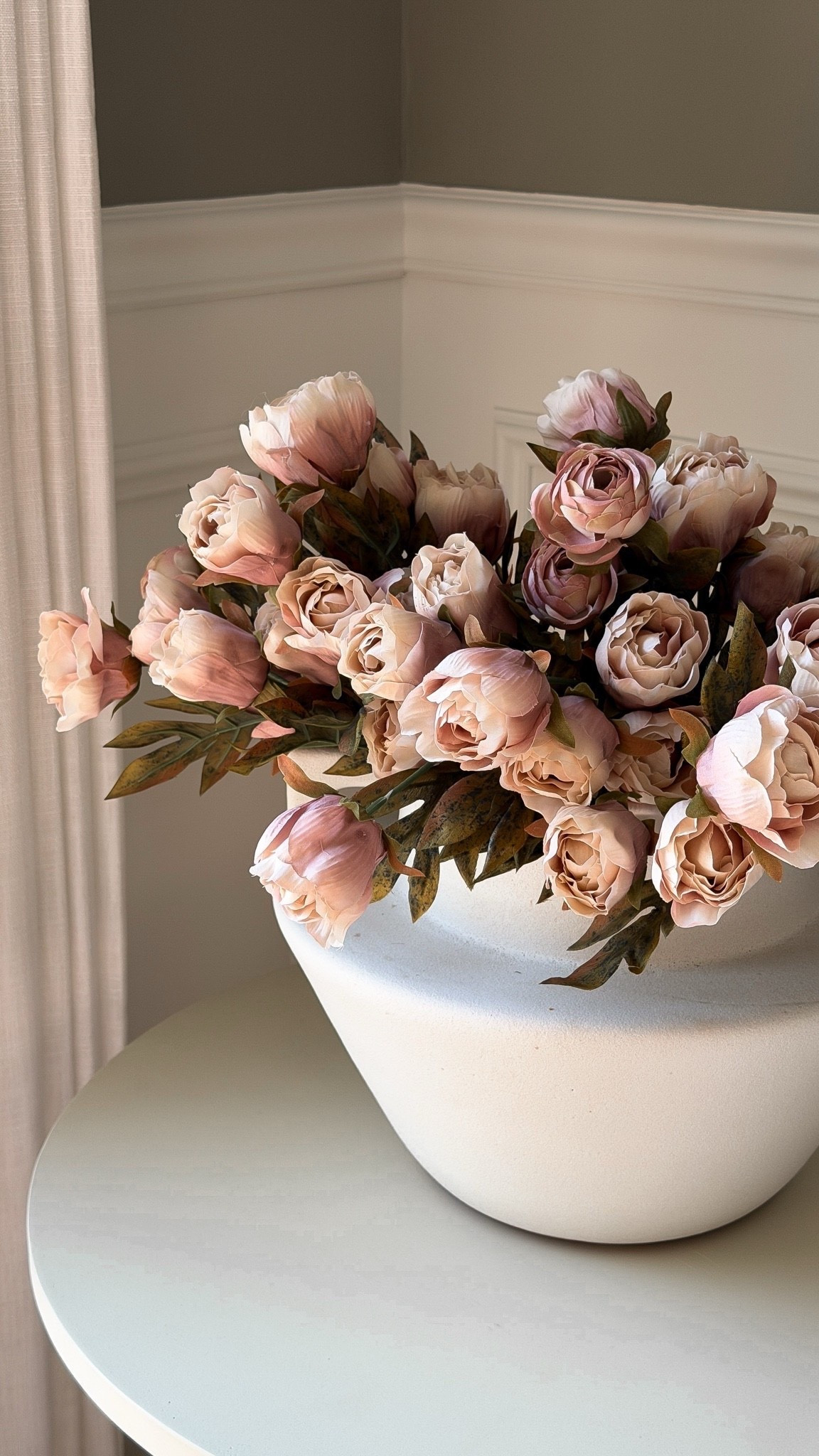These gorgeous artificial peonies add a touch of elegance to any space. This is the 'brownish' color—a soft mauve colorway! They come with 12 stems, making the perfect large arrangement.

#LTKHome