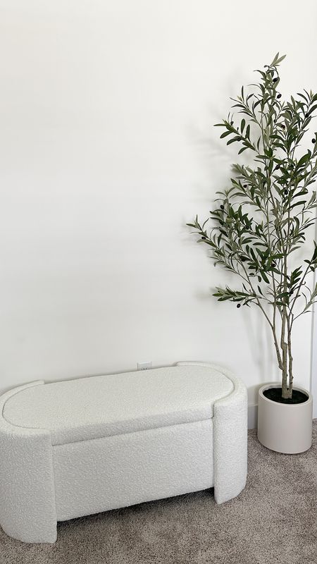 Latest amazon home finds 🤍 just unboxed both so the olive tree is still fluffing out but it’s gorgeous and I love that it comes potted! I got the 6 ft option! Boucle bench opens up and has storage inside which I loooove too! 

#LTKstyletip #LTKhome #LTKSeasonal