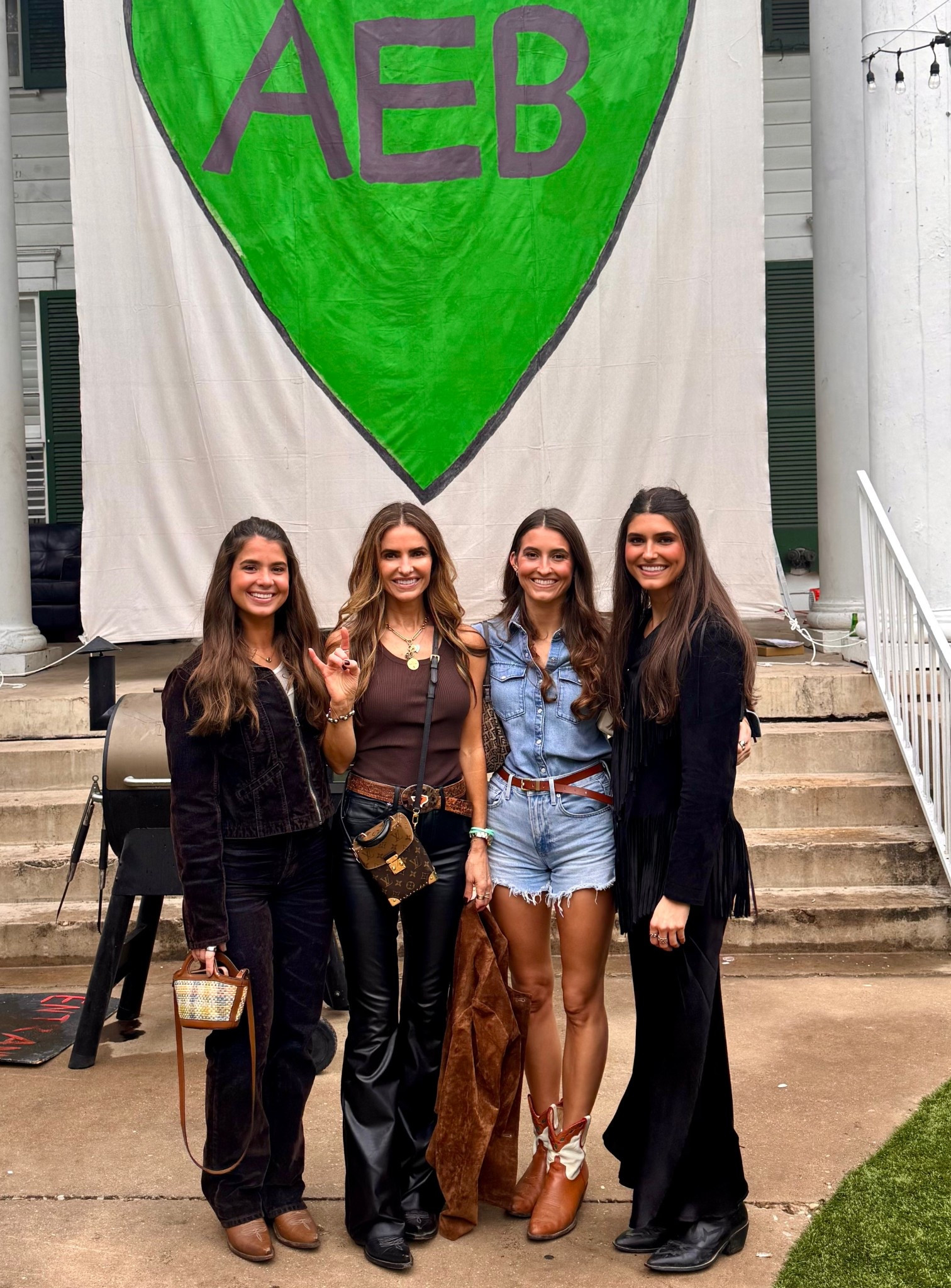 off to texas vs vanderbilt football game #gameday 🤘🏾💚🤘🏾💚 in front of sign for our sweet alli 

shop all our looks below 

#LTKStyleTip #LTKShoeCrush #LTKWorkwear