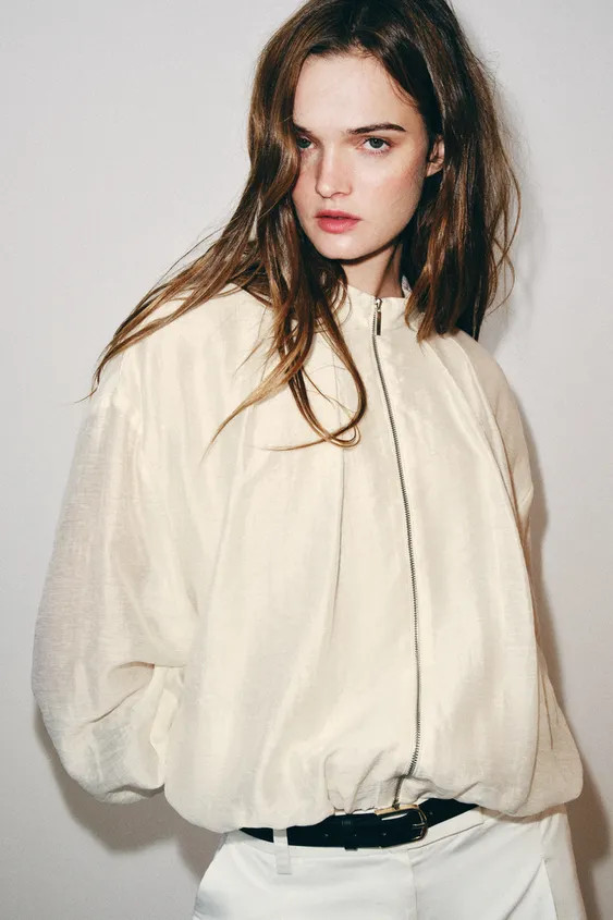 Long-sleeve jacket with a mock neck. Features concealed side seam pockets, elasticized finishes, ... | Zara US