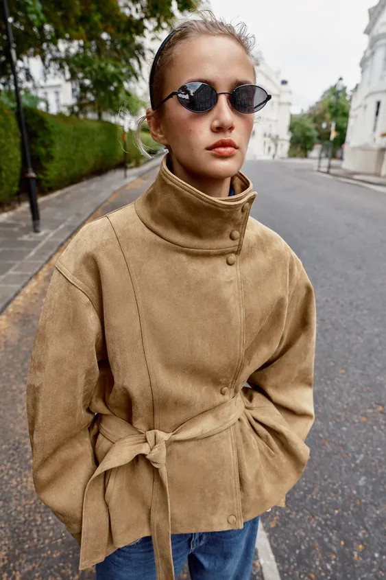 High-neck jacket with long sleeves. Front pockets. Features a matching fabric belt and gathered d... | Zara US