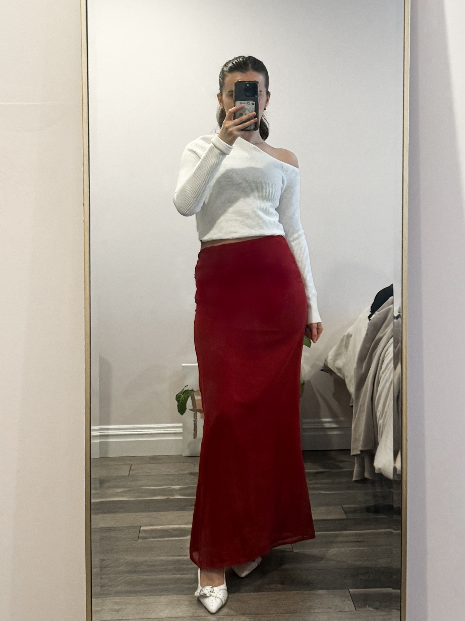 Romantic Valentine’s Day outfit idea: a red satin long skirt paired with a white off-the-shoulder top, slingback kitten heels, and a chic shoulder bag. Perfect for a date night, Galentine’s celebration, or a romantic dinner.
.
.
.
.
.
.
.
Valentine’s Day outfit | winter outfit | skirt outfits | red skirt outfit | red satin skirt | red maxi skirt | cute tops | long skirt | maxi skirt outfit | midi skirt outfit | satin skirt outfit | winter skirt outfit | date night outfit | date night top | white heels | kitten heels | 

#LTKSeasonal #LTKU #LTKSaleAlert #LTKGiftGuide #LTKWorkwear #LTKTravel #LTKShoeCrush #LTKItBag 

#LTKFindsUnder50 #LTKStyleTip #LTKFindsUnder100