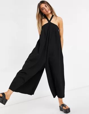 ASOS DESIGN cross neck textured swing smock jumpsuit in black | ASOS (Global)