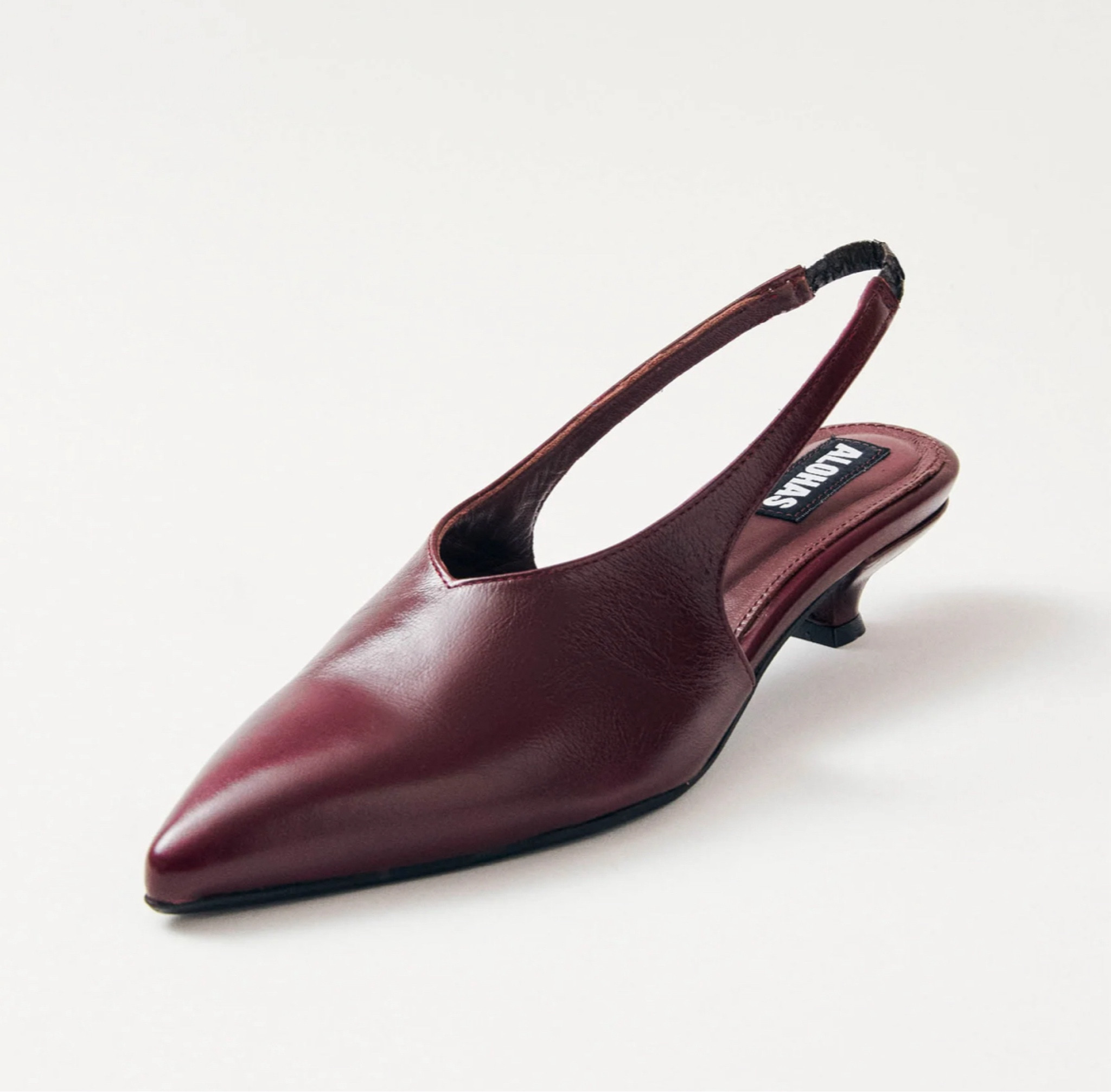 Spot on with all the trends - kitten heel, slingback, burgundy, high vamp.

#LTKShoeCrush