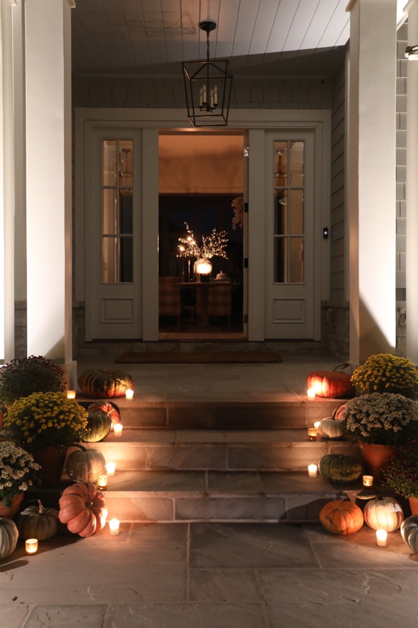 Halloween front porch decor, Halloween, Halloween decor, Halloween decorations, black candlesticks, mums, pumpkins 

#LTKSeasonal #LTKHalloween #LTKhome