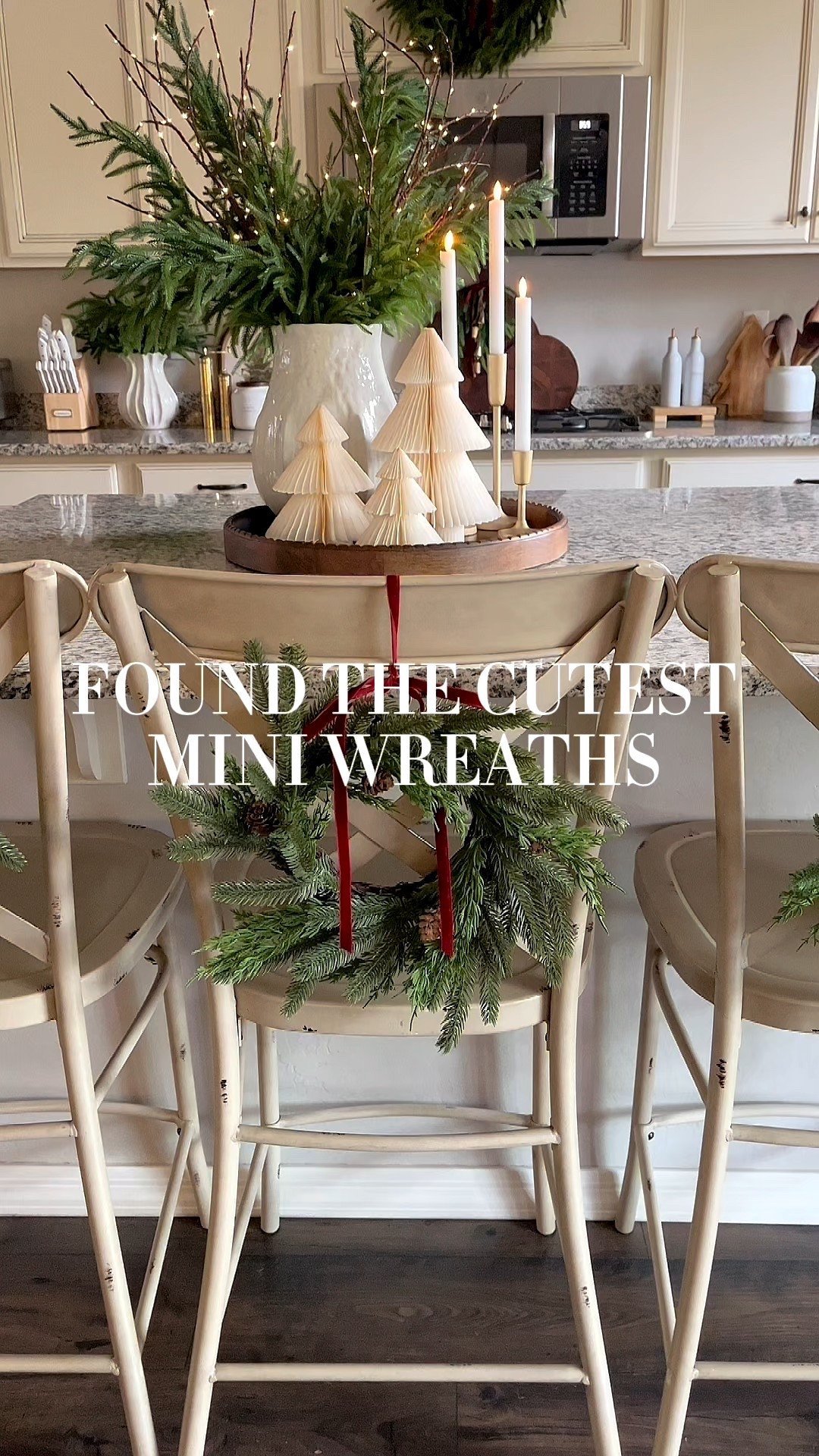 Mini wreaths!  Follow @lifeinmyarizonahome on Instagram for more holiday ideas and inspiration. 

These adorable mini wreaths are perfect for the back of my chairs at the kitchen island. I love the pine cone detail and the addition of the red ribbon that coordinates with the rest the room. 

#christmasdecor #christmaskitchen #miniwreath #holidaydecor 

#LTKSeasonal #LTKHoliday #LTKHome