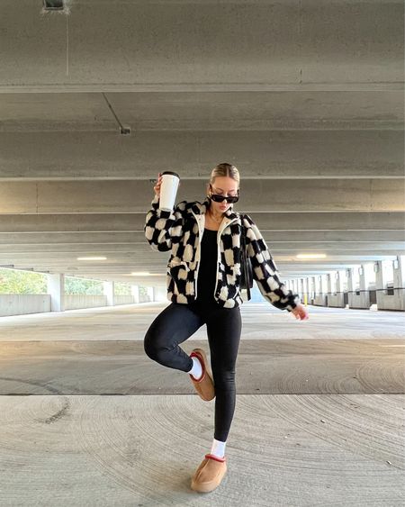 Black jumpsuit, sherpa jacket, hit the slopes jacket, free people sherpa jacket, checkered jacket, winter jacket, ugg tazz slippers, platform Uggs, winter fashion, winter style, winter outfit, Hailey bieber style, comfy style