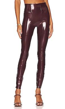 SPANX Faux Patent Leather Leggings in Ruby from Revolve.com | Revolve Clothing (Global)