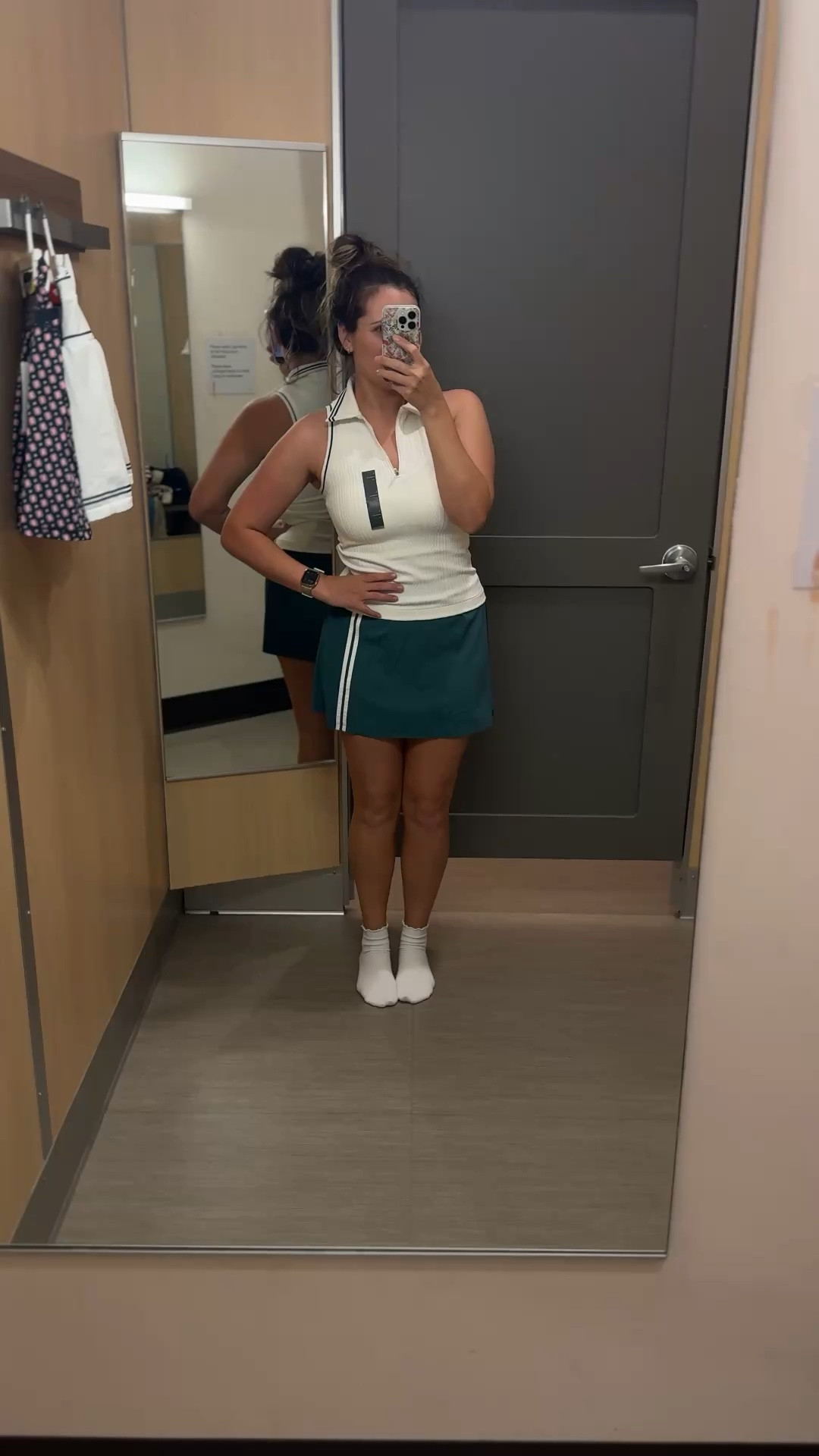 Golf set from target. The skirt is flat in the front with small pleats in the back 