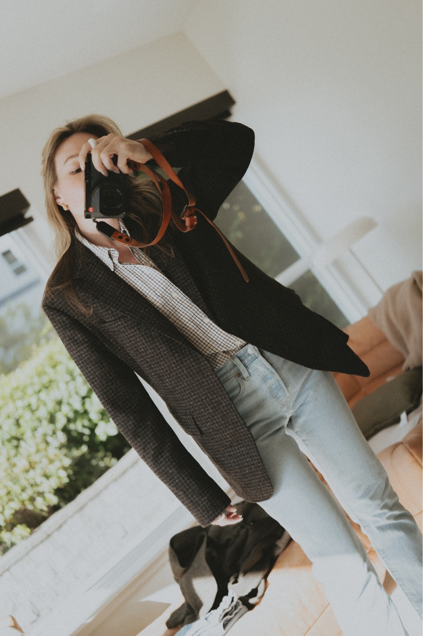 Obsessed with Buck Mason’s new Fall 2026 arrivals. 

Hollywood Blazer in sable check, worn open over the Buck Mason Mainstay shirt in willowcreek check and Levi's 501 jeans in ever afternoon. Grey micro-check wool blazer with a relaxed boyfriend fit and clean notch lapel; the white-and-black check button-down adds a fine grid print under it; light-wash straight-leg 501 denim finishes the look with a vintage high-rise cut. Gold drop earrings. Fall outfit styling: sable check blazer with light-wash straight-leg jeans, checked shirt layered under a wool blazer, smart-casual capsule wardrobe, quiet-luxury tailoring, and workwear-to-weekend looks for women.