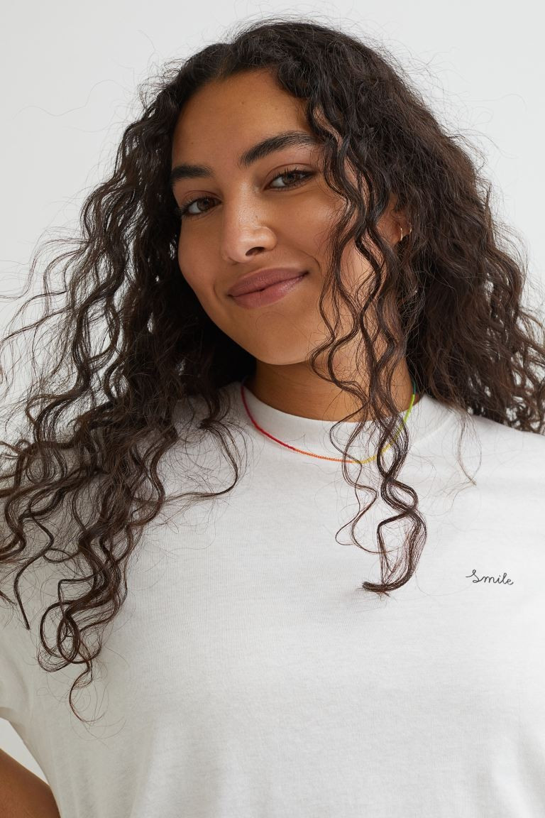 T-shirt in soft cotton jersey with a printed text detail at top. | H&M (US + CA)