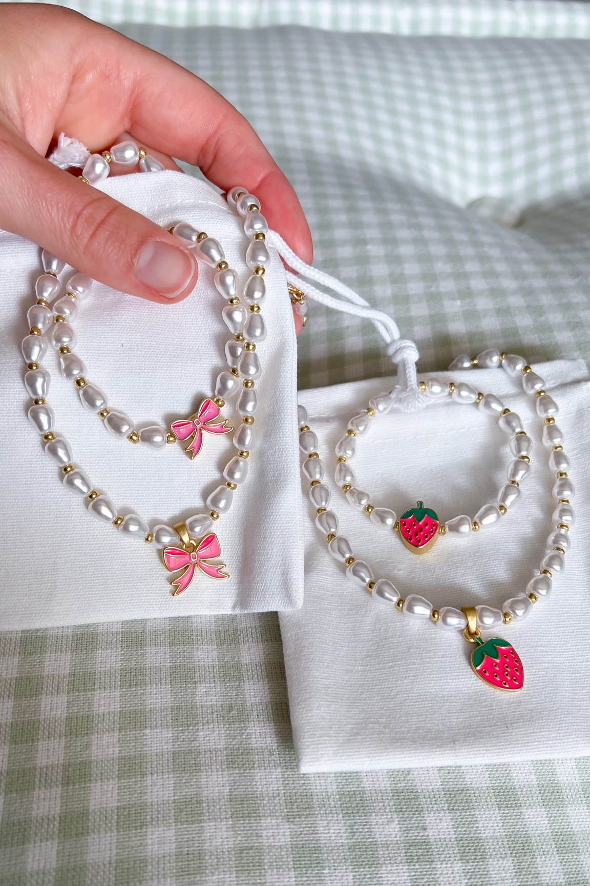 Cute jewelry for little girls - Adding one set of these in Millie’s Halloween gift basket and also her Christmas stocking. The pearls, bows, and strawberry charms are so sweet and they have lots of other charm designs to choose from as well. An affordable gift idea for girls!

Necklace, bracelet, kids jewelry, children, toddler gift ideas, gifts for kids, toddler girls style, little girls fashion, budget friendly #giftsforkids #giftsforgirls #kidsjewelry #girlsstyle #giftguide 

#LTKkids #LTKGiftGuide #LTKfindsunder50