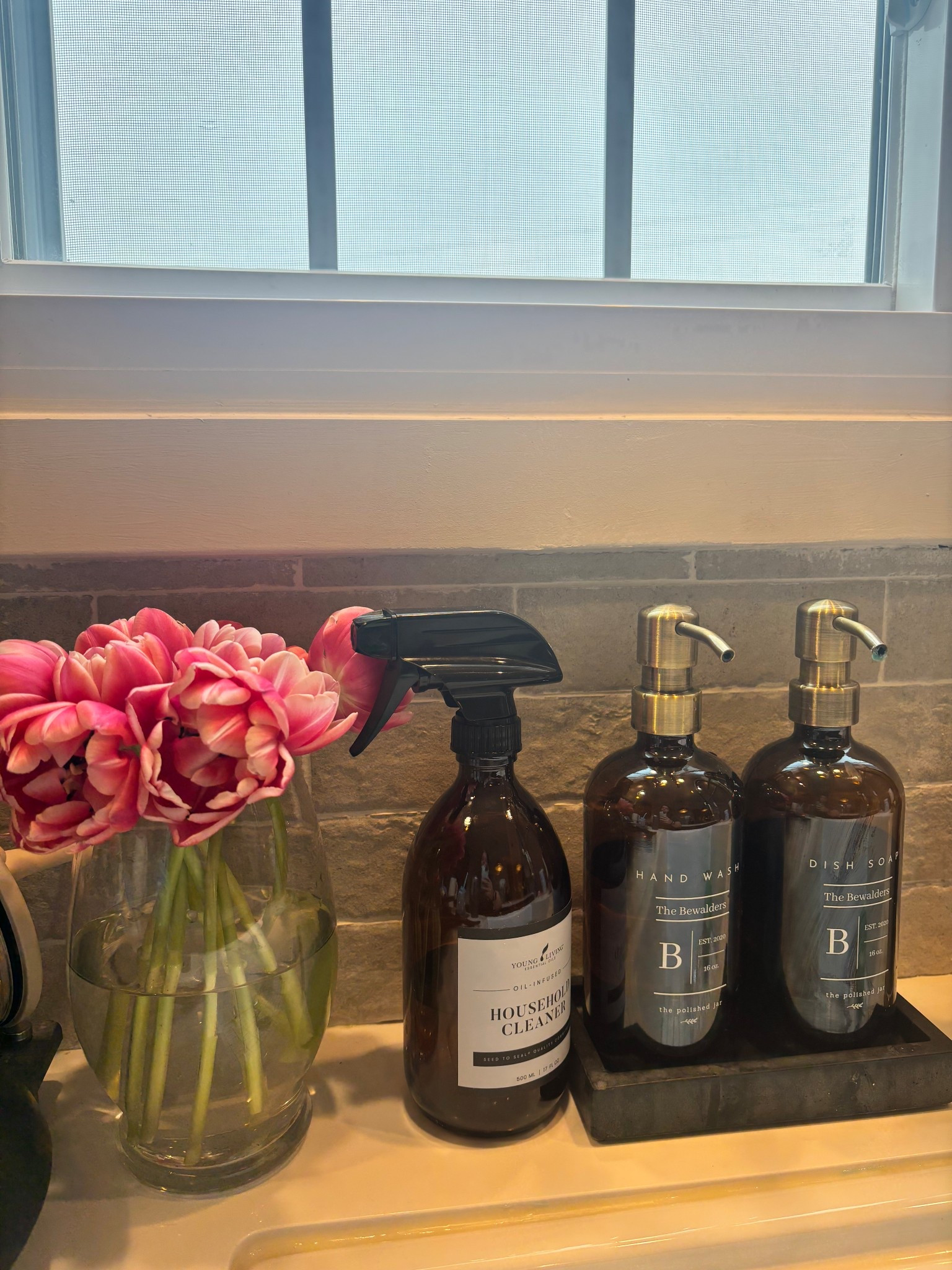 Peony tulips from Trader Joe’s 
Custom soap dispenser and concrete tray 
Neutral kitchen renovation 

#LTKHome #LTKFindsUnder50 #LTKFindsUnder100