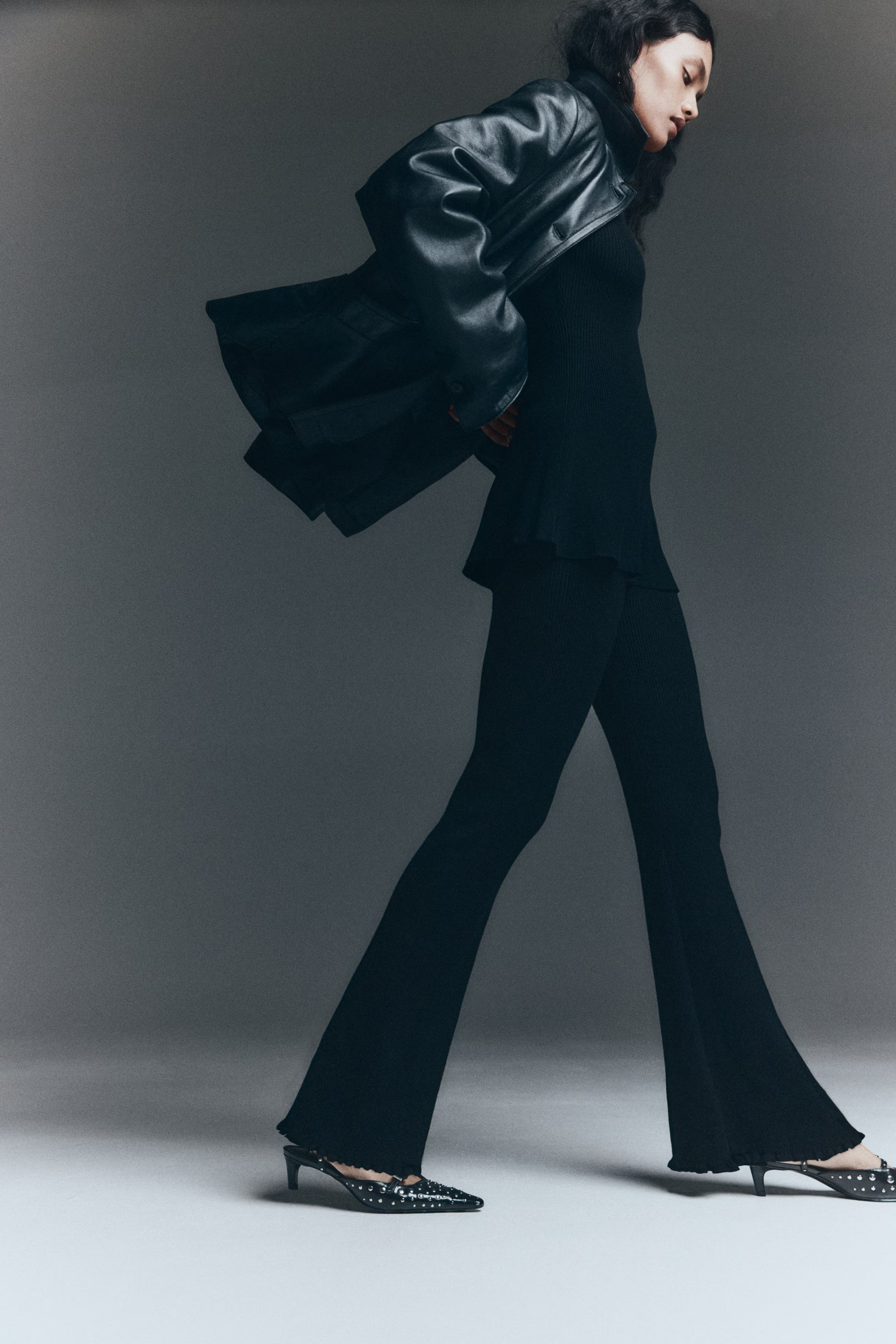 Flared rib-knit trousers - Black - Ladies | H&M GB | H&M (UK, MY, IN, SG, PH, TW, HK)