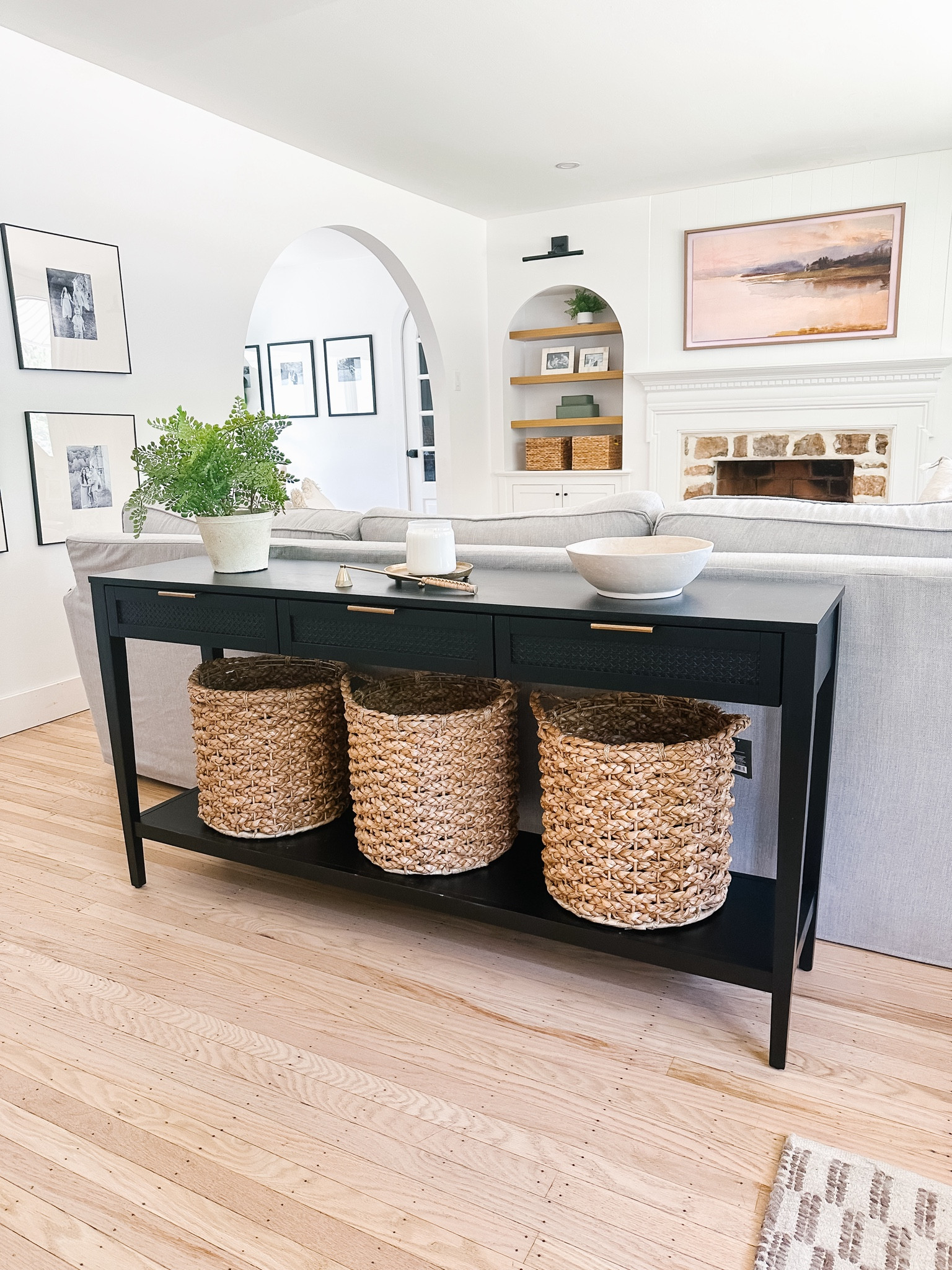 Organic modern living room

Black target console table, wicker baskets, picture frames, gallery wall, Samsung frame tv, wall sconces 

#LTKHome #LTKFindsUnder100 #LTKSaleAlert