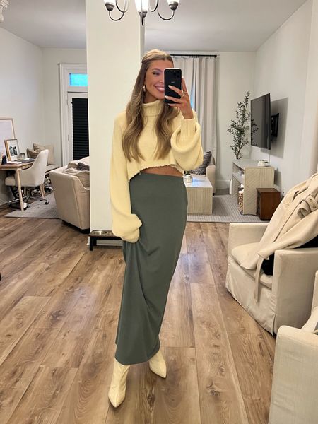 date night outfit 🤍🫒🍸 green maxi skirt from pretty little thing is SO soft and comfortable. paired with my favorite boots ever from Schutz [ordered mine on amazon!] and a matching cream cropped turtleneck sweater from Revolve 🫶🏽

#LTKstyletip #LTKshoecrush #LTKFind