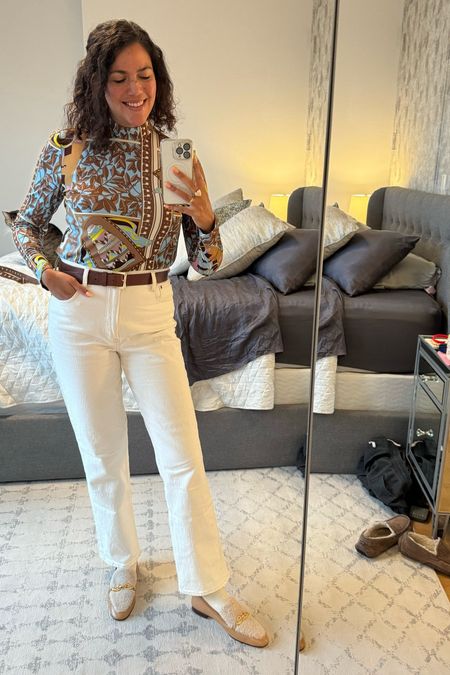 I always feel so chic in winter whites! This is a casual Friday office outfit, with a printed silk turtleneck from Tory Burch (size 10) tucked into cream straight leg Abercrombie jeans (size 30). Shearling Tory Burch loafers (size 11) and a simple belt from Amazon finish off the look!

#LTKworkwear #LTKmidsize #LTKSeasonal