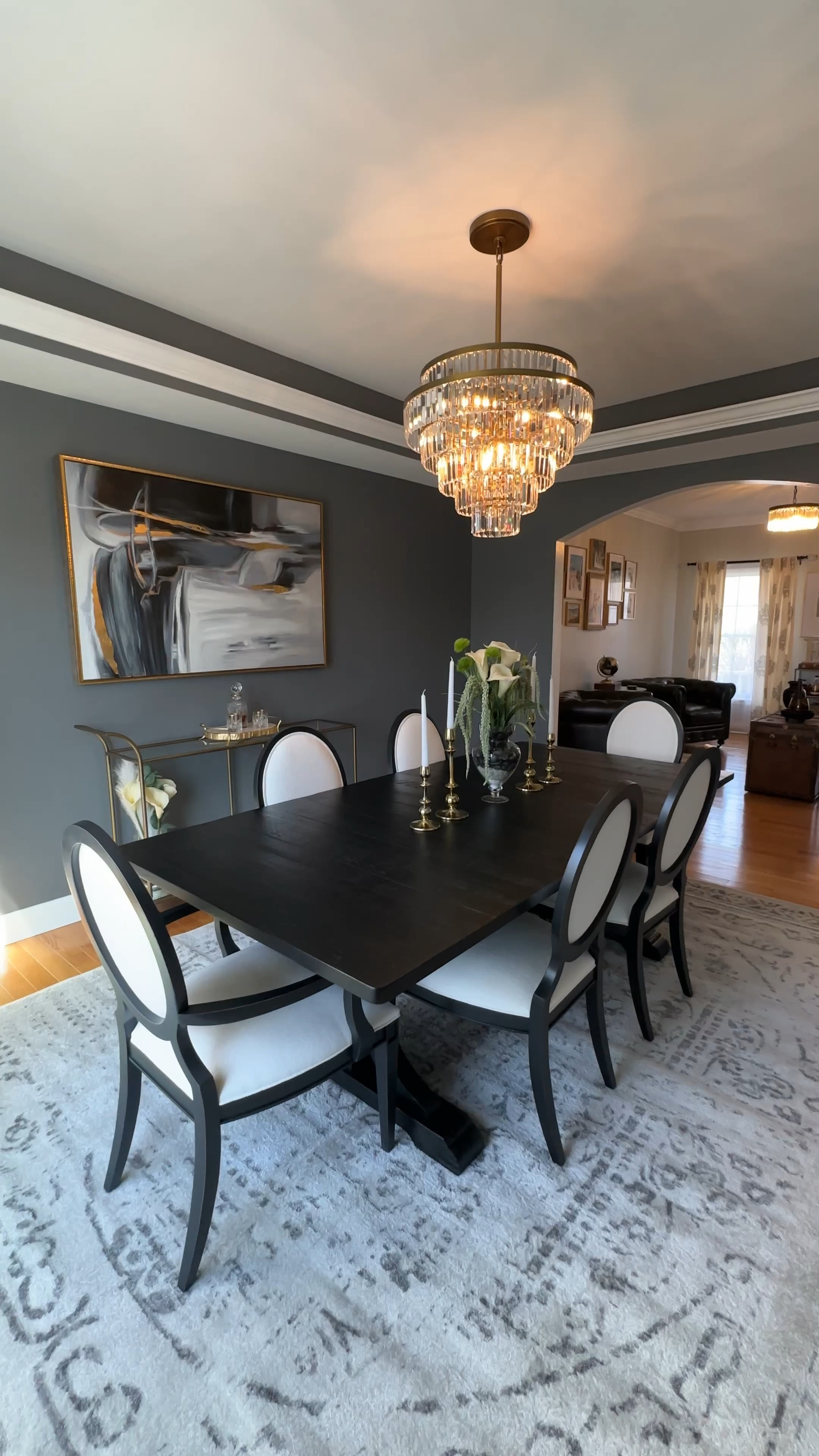 Our dining room is finally finished! 

Chandelier: Pottery Barn 
Table and chairs: Ethan Allen (could not find link but will link similar) 
Rectangle bar cart: Ballard Design 
Curtains: Ballard Design 

#LTKFind #LTKhome