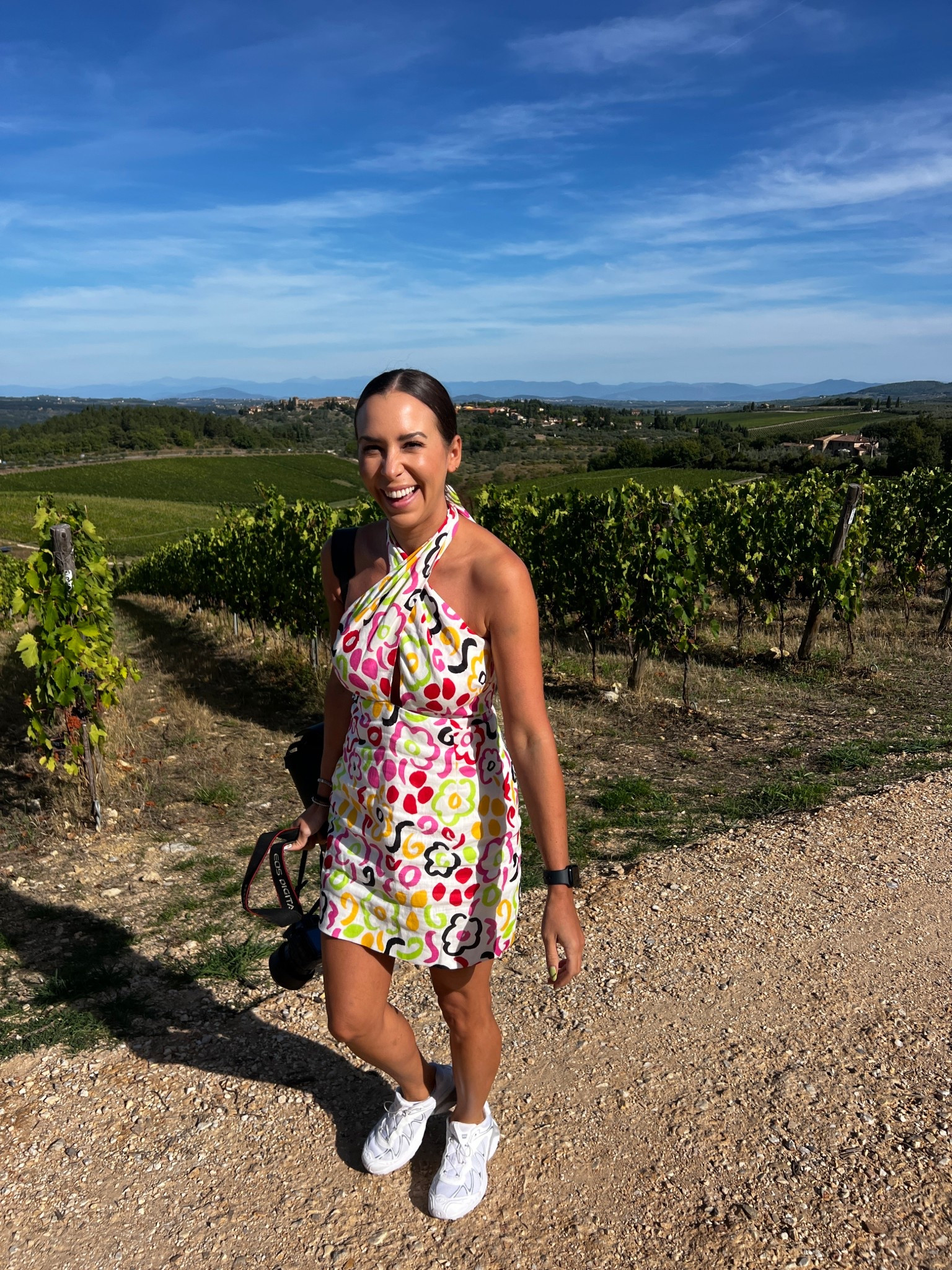 winery tour in chianti italy and wearing linen. printefd linen dress by Rhode (clothing company) Salomon sneakers, and a senreve bag.
white sneakers. sneakers and a dress. printed mini. linen dress. salomon. senreve. leather bookbag. italy travel. 

 

#LTKSaleAlert #LTKFindsUnder100 #LTKTravel