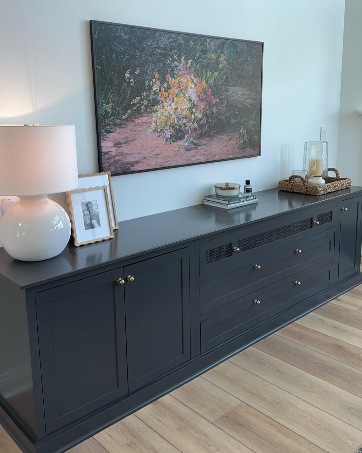 the living room got a new look! TV console styling #frametv #tvconsole 

#LTKHome
