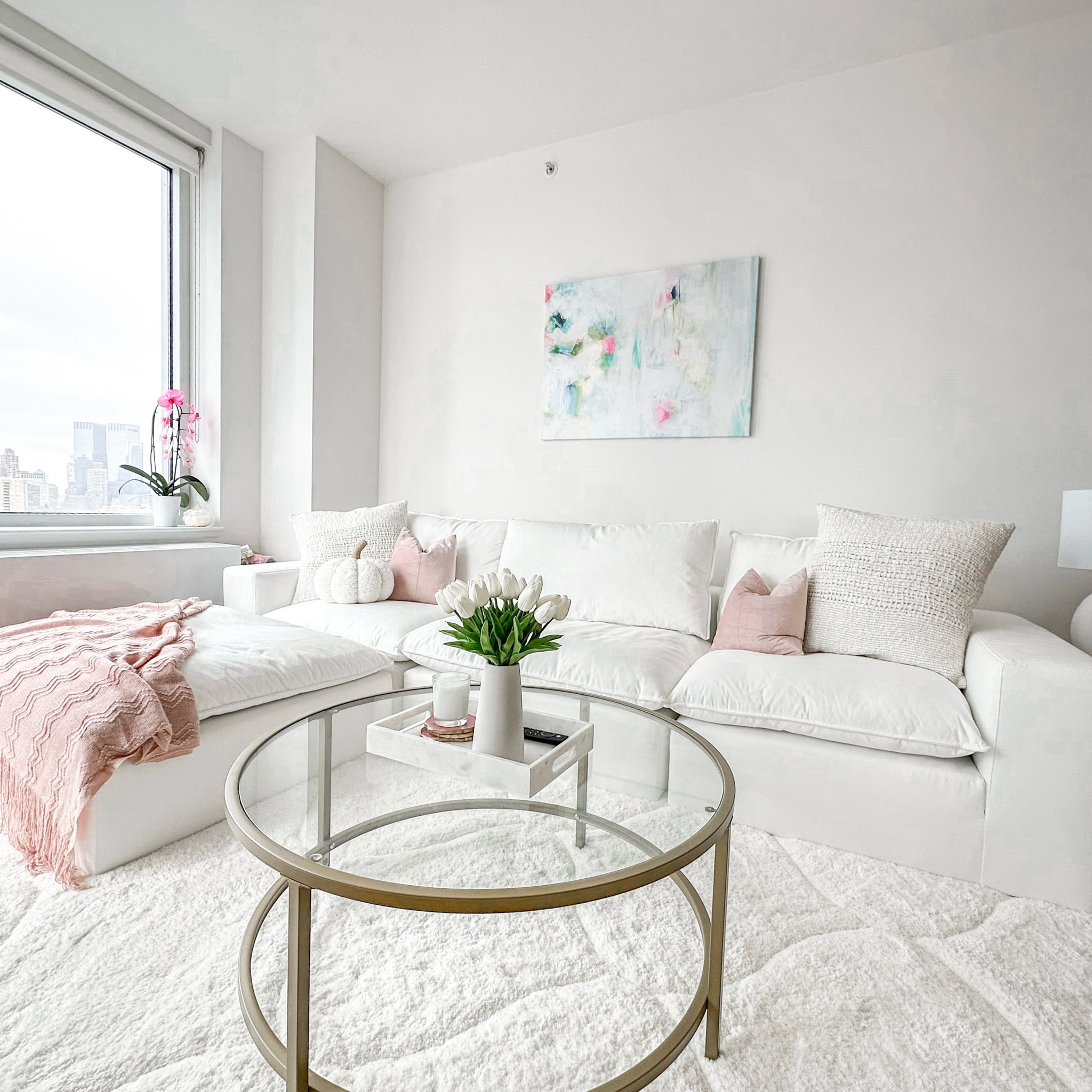 Living room couch, painting, table, blanket, + pillows in our nyc apartment!!

#LTKhome