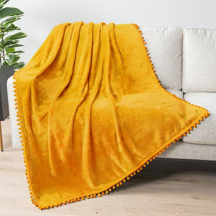 PAVILIA Fleece Throw Blanket for Couch with Pom Pom Fringe, Mustard Yellow, Soft Cozy Fuzzy Flann... | Amazon (US)