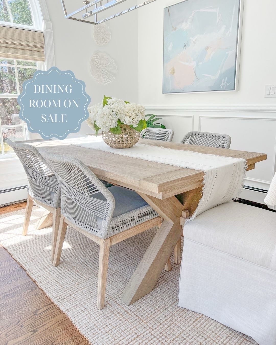 Dining table, rug, rope chairs, woven shades, wall coral and my vase are all on sale! My table, in the seadrift finish, is the 74"-104" size, my rug is the natural color, and my woven shades are "tibet ivory." 
---- 
coastal dining room, dining room decor, neutral dining room, neutral home decor, neutral decor, beach decor, beach style, dining room furniture, dining room ideas. faux flowers, amazon hydrangeas, woven vase, large vase, serena & lily vase, coral wall decor, dining room table chairs, pottery barn dining table, Toscana dining room table, dining room chairs, dining room rugs, pottery barn rugs, coastal rugs, coastal artwork, abstract artwork, large artwork, blue artwork, woven shades, 8x10 rugs, 5x8 rugs, 9x12 rugs, dining room tables on sale, dining room ideas, dining room decor, white dining room, jute rugs, wool rugs, neutral rugs, dining tables with leafs, home sales, dining tables on sale

#LTKSaleAlert #LTKCyberWeek #LTKHome