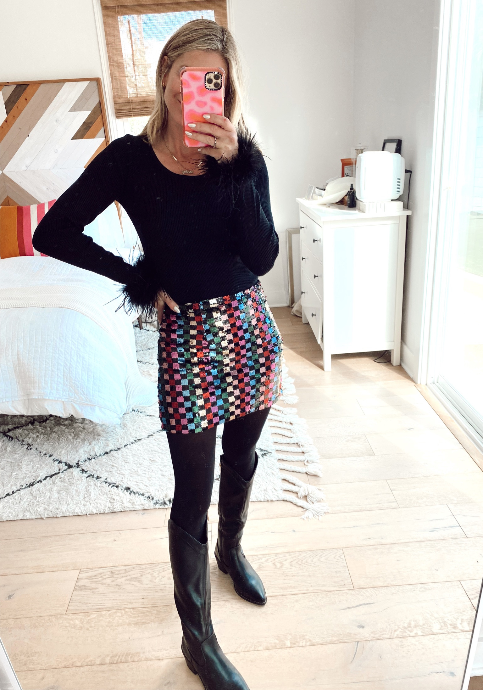 Feather top and sequin mini skirt with under $100 black western boots 

#LTKHoliday #LTKunder100 #LTKSeasonal
